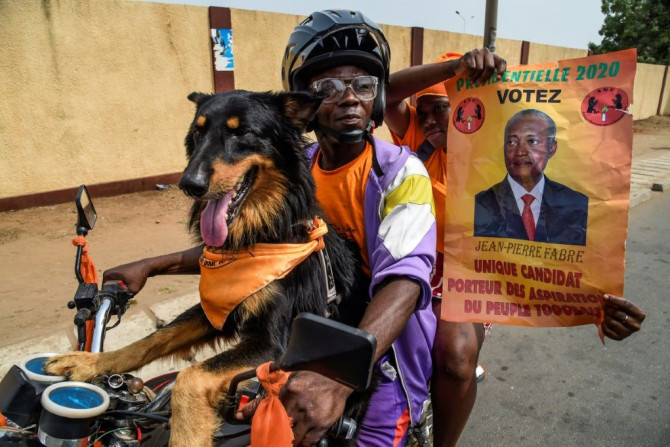 Canine backing: Supporters of opposition candidate Jean-Pierre Fabre, champion of the National Alliance for Change party