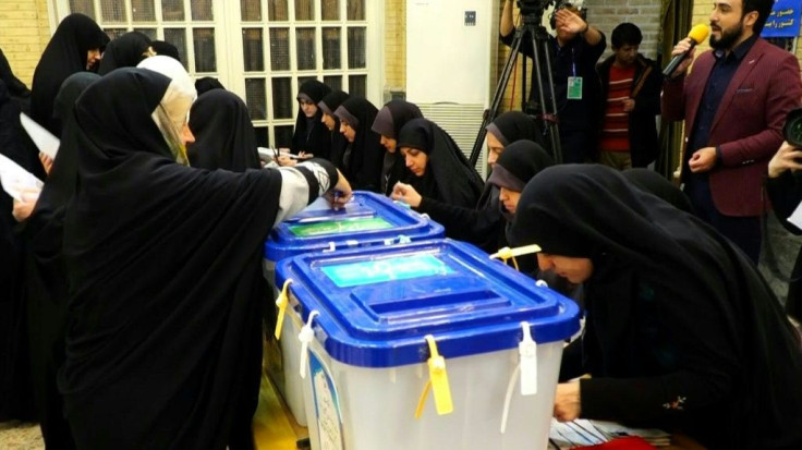 Iranians head to the polls for a general election that conservatives are expected to dominate amid voter apathy after an economic slump, multiple crises and the disqualification of thousands of candidates.