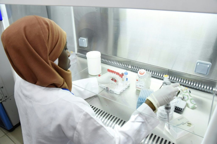 A scientist researches the new coronavirus at the Pasteur Institute in Dakar in February 2020