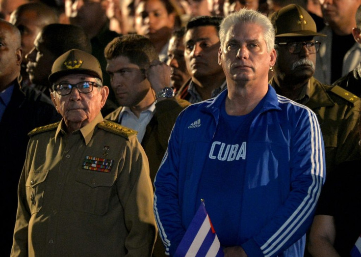 President Miguel Diaz-Canel (R), here with his predecessor Raul Castro, is trying to re-negotiate Cuba's foreign debt as it struggles under US sanctions