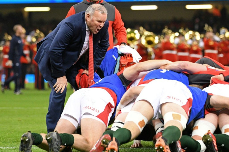 Wales coach Wayne Pivac watches as his players practice a scrum
