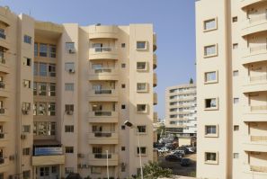 Housing boom: New apartment blocks are being built in Dakar, but spiralling rents make living there a distant dream for many