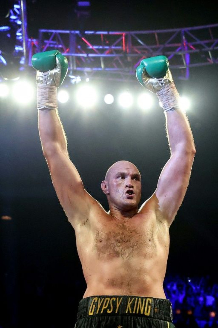 Tyson Fury celebrates his seventh-round TKO triumph in his WBC heavyweight world title rematch against Deontay Wilder