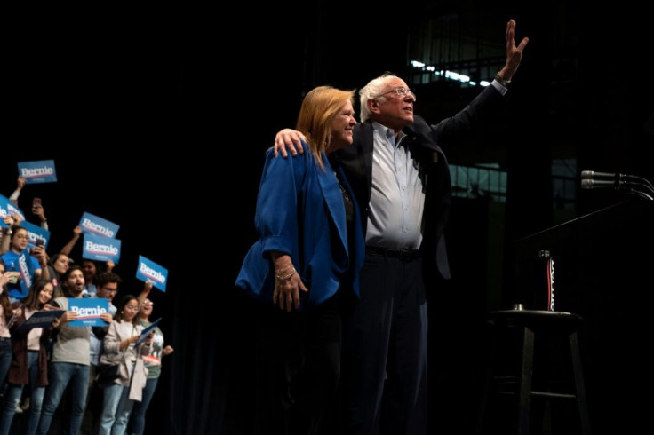Democratic presidential hopeful Bernie Sanders waves as he leaves the stage with his wife Jane Sanders after speaking during a rally in El Paso, Texas on February 22, 2020