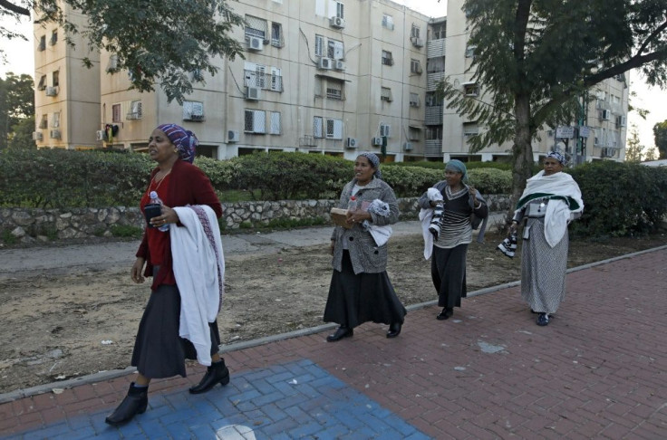 Women of the Ethiopian Jewish community walk in the central Israeli city of Rehovot