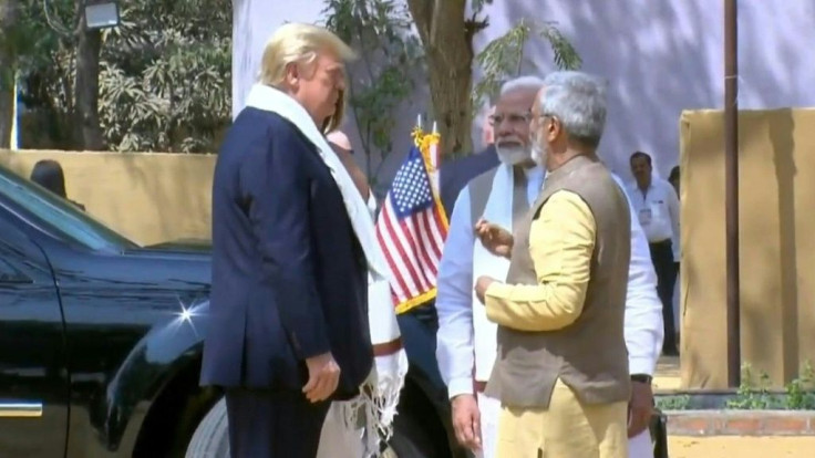 Donald Trump and wife Melania tour Mahatma Gandhi's former home in Ahmedabad alongside Prime Minister Narendra Modi, as the US president and first lady are welcomed to the western Indian city on their whistle-stop, 36-hour official visit.