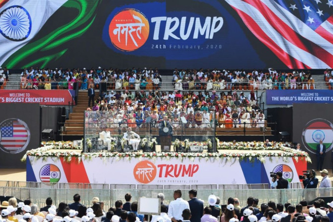 Trump and Modi speak from behind bullet-proof screens during a rally at Sardar Patel Stadium in Ahmedabad