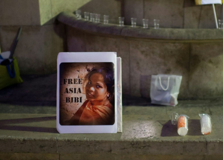 In this file photo taken on October 29, 2014, a portrait of Pakistan's Asia Bibi is displayed during a demonstration to protest against her death sentence, in Paris; she has sought political asylum from France