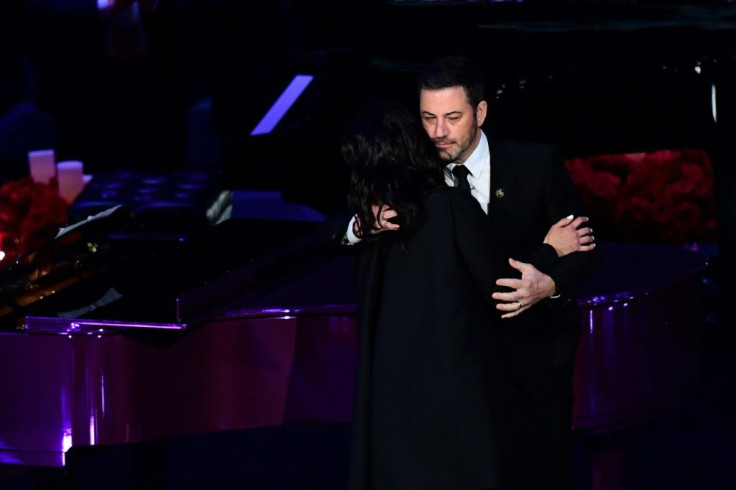 Kobe Bryant's wife Vanessa Bryant (L) hugs US television host Jimmy Kimmel as she arrives