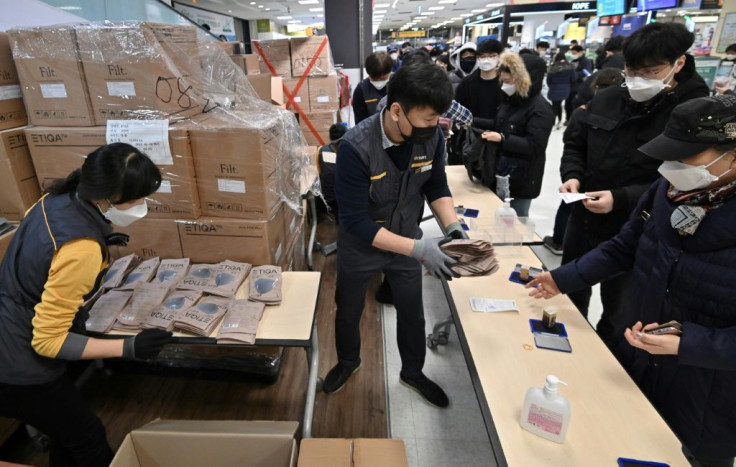 People buy face masks at a retail store in the southeastern city of Daegu, South Korea