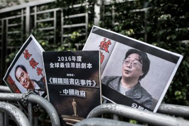 Placards showing missing bookseller Gui Minhai (R) and associate Lee Bo (L) left by members of the Civic party outside the China liaison office in Hong Kong in January, 2016