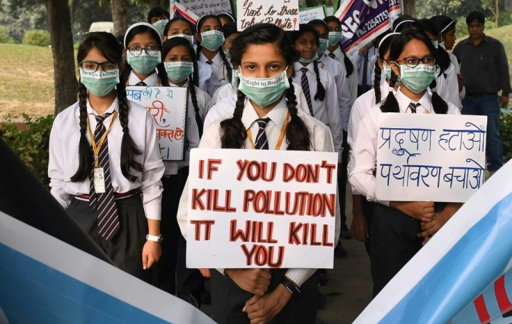 Indian school children march to raise awareness about air pollution levels in New Delhi
