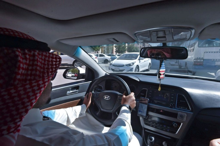 Hussein starts his day's work for ride-hailing service Uber in the Saudi capital Riyadh
