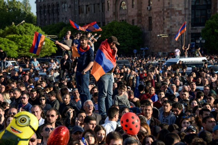 Armenians celebrate Serzh Sarkisian's resignation as premier in downtown Yerevan on April 23, 2018 following mass protests against his switch to the newly-empowered role of prime minister after his second and last term as president expired.