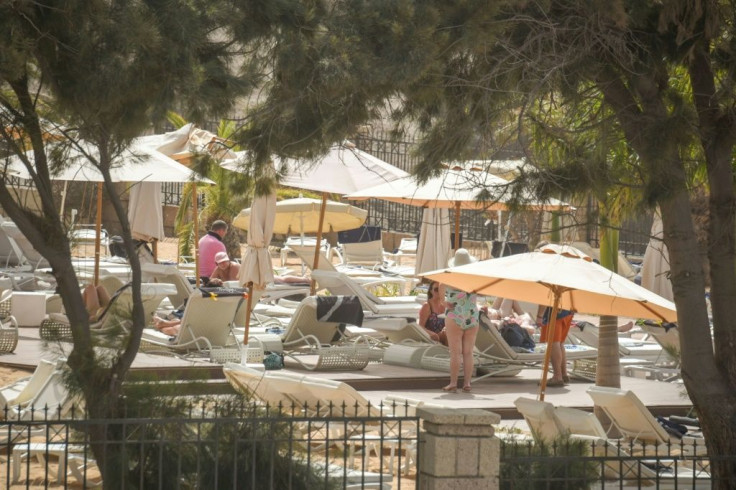 Some tourists made the most of the shutdown to sunbathe by the pool