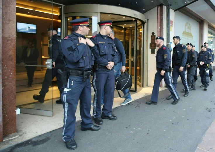 Police officers close a hotel near the city centre in Innsbruck on February 25 after a woman who worked there was confirmed to have coronavirus