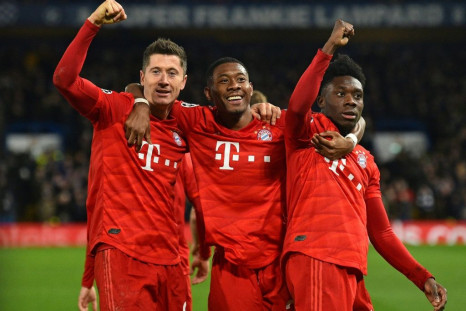 (From left) Robert Lewandowski, David Alaba and Alphonso Davies celebrate Bayern's third goal at Chelsea