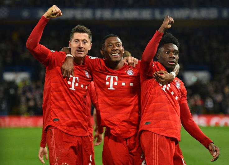 (From left) Robert Lewandowski, David Alaba and Alphonso Davies celebrate Bayern's third goal at Chelsea