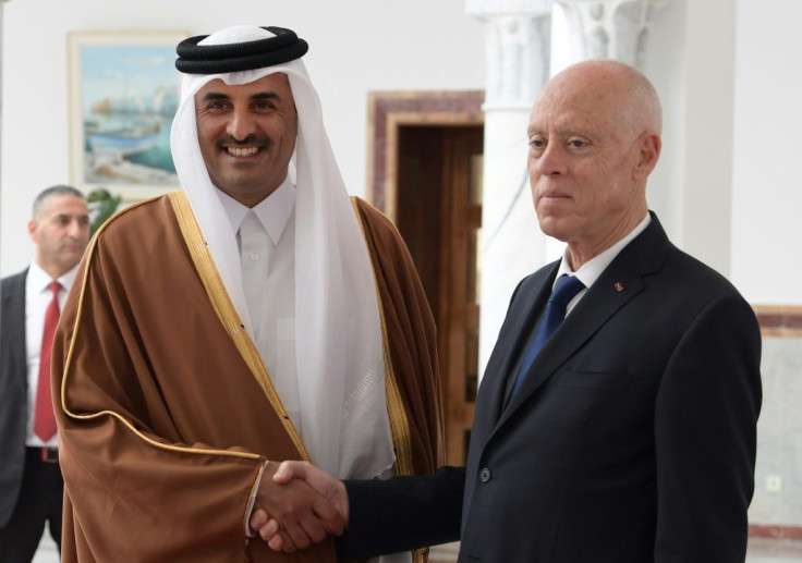 Qatar's Emir Sheikh Tamim bin Hamad al-Thani (L) meets Tunisia's President Kais Saied in the Tunisian capital on February 24