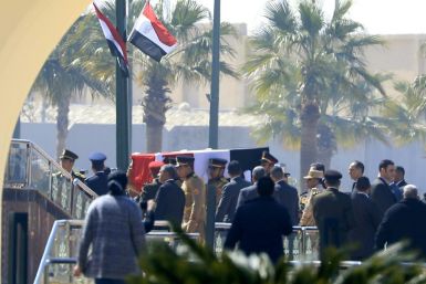Egyptian honour guards carry the coffin of former president Hosni Mubarak before his funeral ceremony at Cairo's Mosheer Tantawy mosque in Cairo
