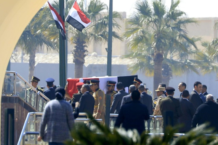 Egyptian honour guards carry the coffin of former president Hosni Mubarak before his funeral ceremony at Cairo's Mosheer Tantawy mosque in Cairo