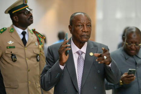Man in a hurry: Guinean President Alpha Conde, centre, at an African Union summit in Addis Ababa this month