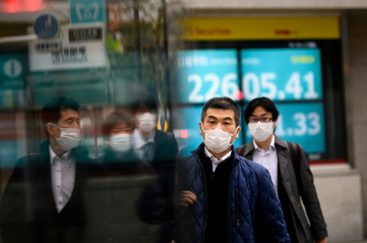 Pedestrians wearing face masks against the spread of the coronavirus spotted on a street in Tokyo