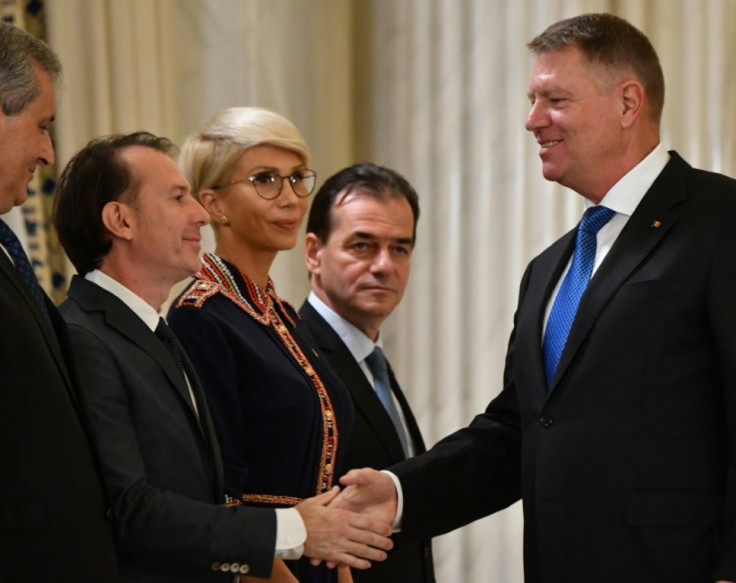 Romanian president Klaus Iohannis (R, pictured November 2019) shakes hands with Florin Citu