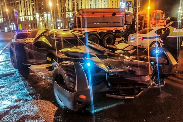 This handout photo from Russian Interior Ministry taken on February 22, 2020 shows Russian traffic policemen standing next to a vehicle in Moscow that bears a striking resemblance to the "Batmobile"