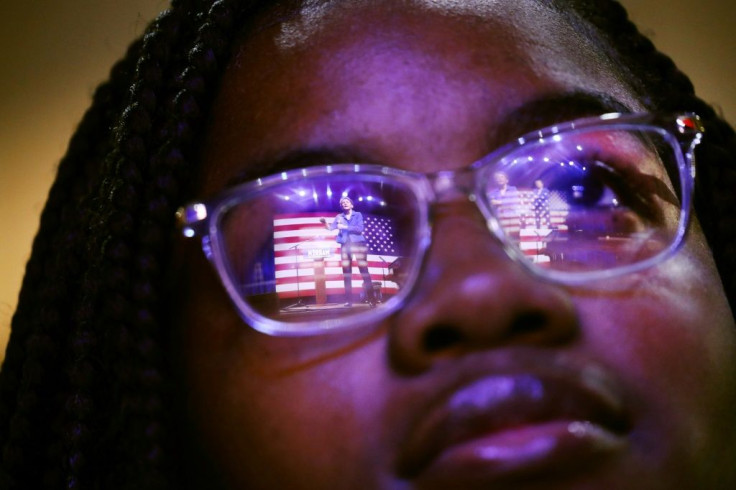 Democratic presidential candidate Elizabeth Warren is reflected in a student's glasses as she speaks at South Carolina State University