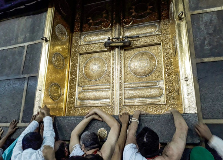 Muslims pilgrims gather outside the door of the Kaaba, Islam's holiest shrine, in Mecca, Saudi Arabia