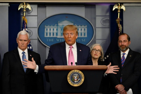 US President Donald Trump, flanked by Health and Human Services Secretary Alex Azar (R), US Vice President Mike Pence (L) and CDC Principal Deputy Director Anne Schuchat, holds a news conference on the COVID-19 outbreak