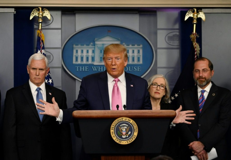 US President Donald Trump, flanked by Health and Human Services Secretary Alex Azar (R), US Vice President Mike Pence (L) and CDC Principal Deputy Director Anne Schuchat, holds a news conference on the COVID-19 outbreak