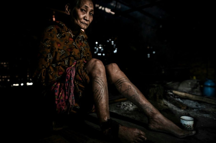 The Naga tribes in Myanmar's far north would use a thorn to drive tree sap under the warrior's skin to ink a permanent reminder of his headhunting prowess -- and his family would often follow suit