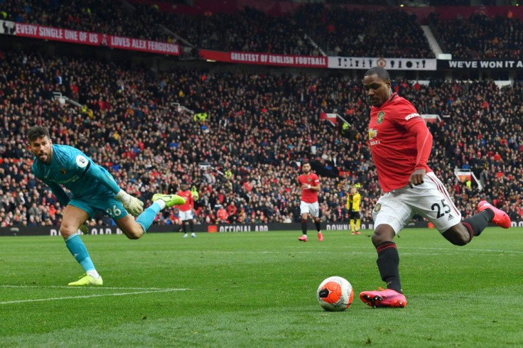 Odion Ighalo has joined Manchester United from China's Shanghai Shenhua on loan(R) rounds Watford's English goalkeeper Ben Foster (L) during the English Premier League football match between Manchester United and Watford at Old Trafford in Manchester,