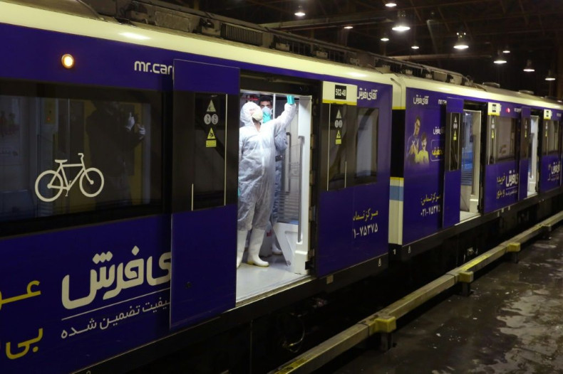 A Tehran municipality worker cleans a metro train to avoid the spread of the COVID-19 illness