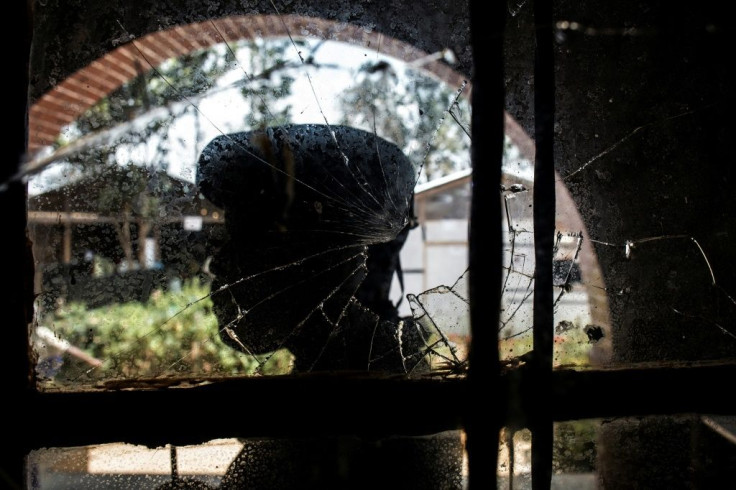 A policeman stands guard at an Ebola treatment centre in eastern DR Congo that came under gun attack last March. Conflict in the region is hampering efforts to roll back the notorious virus