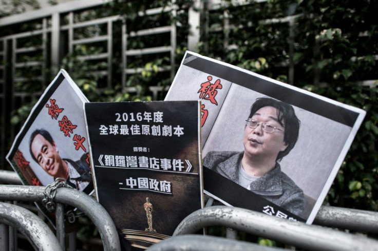 Placards showing missing bookseller Lee Bo (left) and his associate Gui Minhai (right) are left outside the China liaison office in Hong Kong following a January 2016 protest