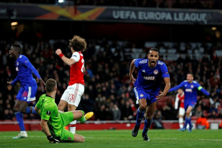 Moroccan striker Youssef El-Arabi celebrates the Olympiakos winner after 120 minutes at Arsenal
