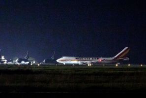 A plane carrying American passengers, who were released from the Diamond Princess cruise ship in Japan, arrives at Travis Air Force Base in California on February 16