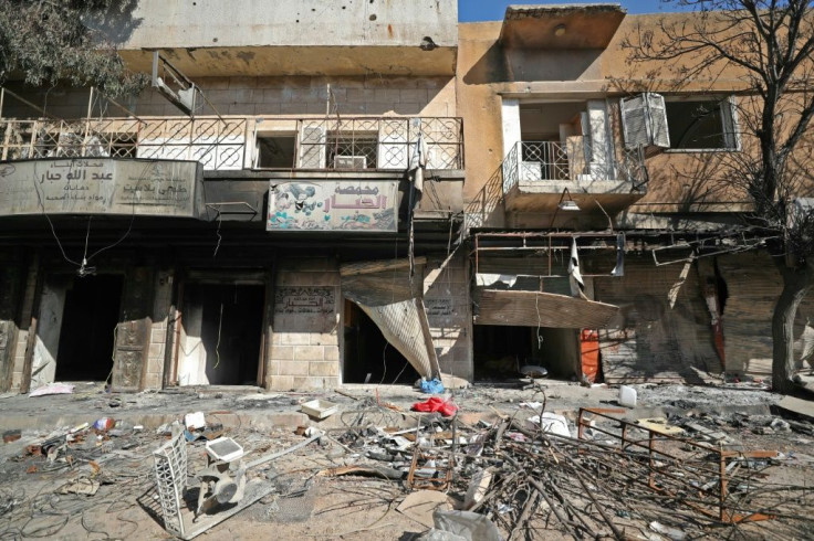 Damaged shops and rubble-strewn streets in the Idlib town of Saraqeb, which rebels re-entered in a reversal of one of the Syrian government's main gains in a devastating offensive