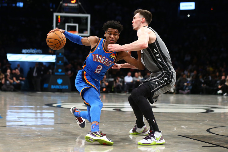 Shai Gilgeous-Alexander of the Oklahoma City Thunder and Rodions Kurucs of the Brooklyn Nets