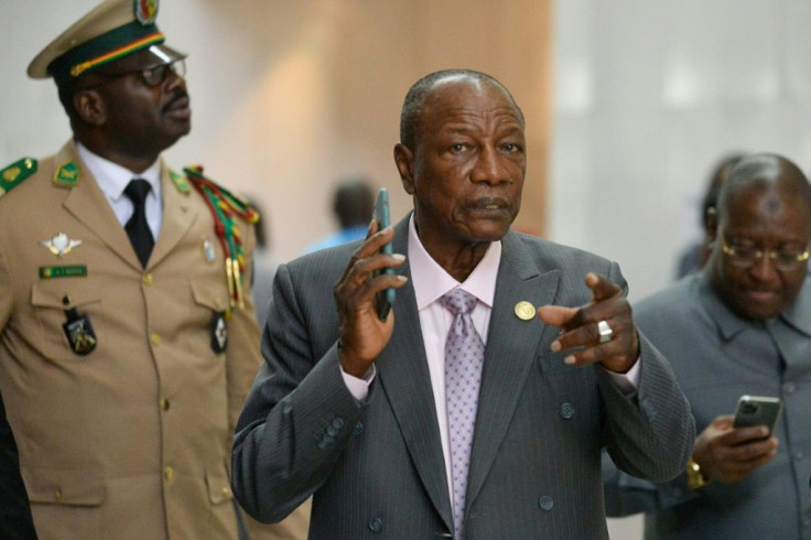 Guinea's President Alpha Conde (C), seen here in early February, did not publicly announce a date for the new referendum