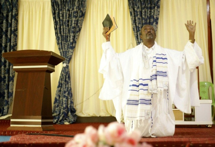 Evangelical leader Tamirat Biranu, seen here praying, says anger is driving young people into the arms of the rebels
