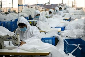 Ugly Duck Industry in Wenzhou, eastern China, has switched production from winter coats to hazmat suits