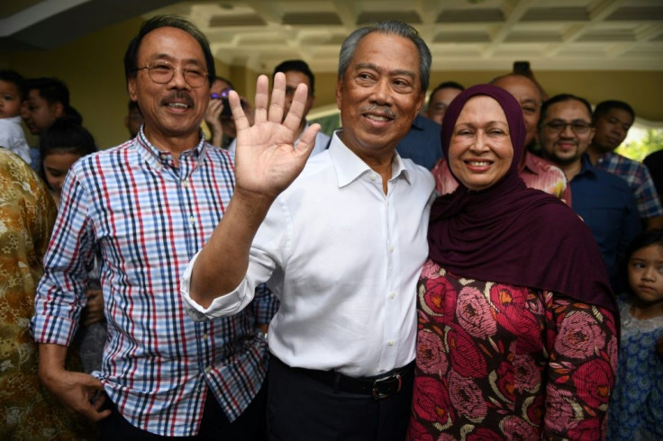Former interior minister Muhyiddin Yassin (C) is set to become Malaysia's prime minister in a shock twist to a week of political chaos