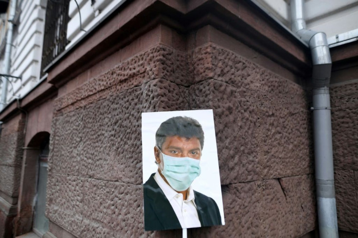A picture of Boris Nemtsov wearing a facemask left during the rally in downtown Moscow