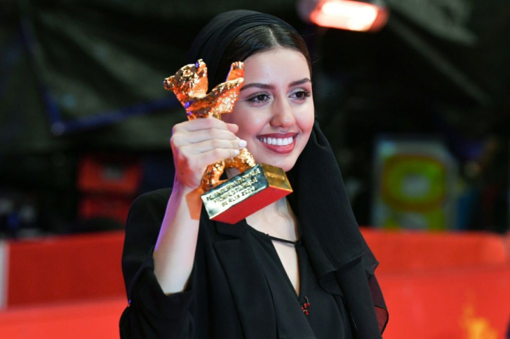 Iranian actress Baran Rasoulof posed with the trophy 'Golden Bear for Best Film', on behalf of her father, director and producer Mohammad Rasoulof, who is not allowed to leave Iran