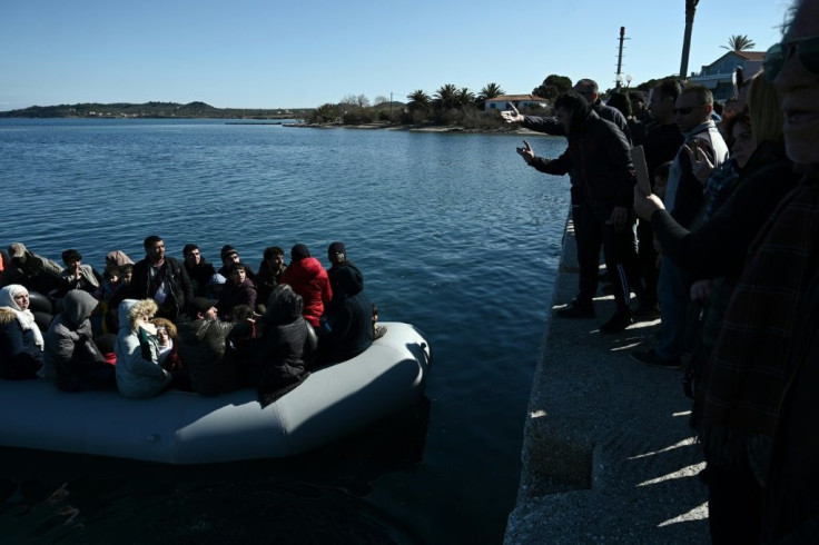 Shouting "Go back to Turkey", furious locals at the port of Thermi blocked migrants from landing