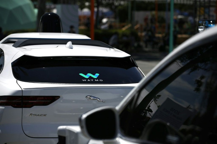 Waymo self-driving vehicles are seen near the Google headquarters in Mountain View, California in 2018